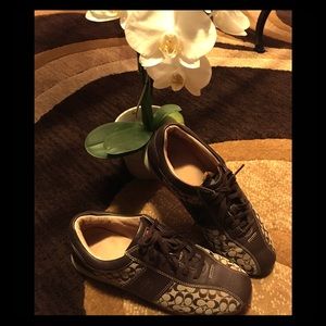 Brown leather and Coach logo sneakers